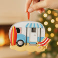 Load image into Gallery viewer, Decorative ornament shaped like a camper with a beach theme, held by a hand against a blurred festive background.
