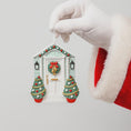 Load image into Gallery viewer, Decorative Christmas door ornament held by a gloved hand with a Santa Claus outfit.
