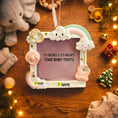 Load image into Gallery viewer, Decorative photo frame with baby-themed elements on a wooden surface.
