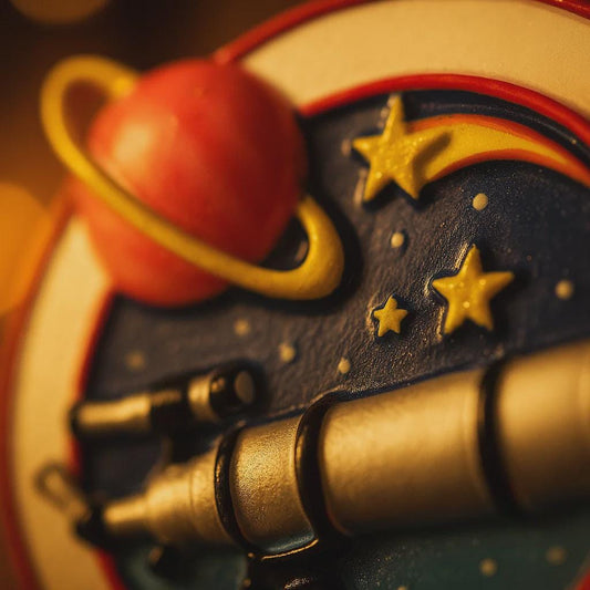 Decorative item with space theme featuring planets and stars.