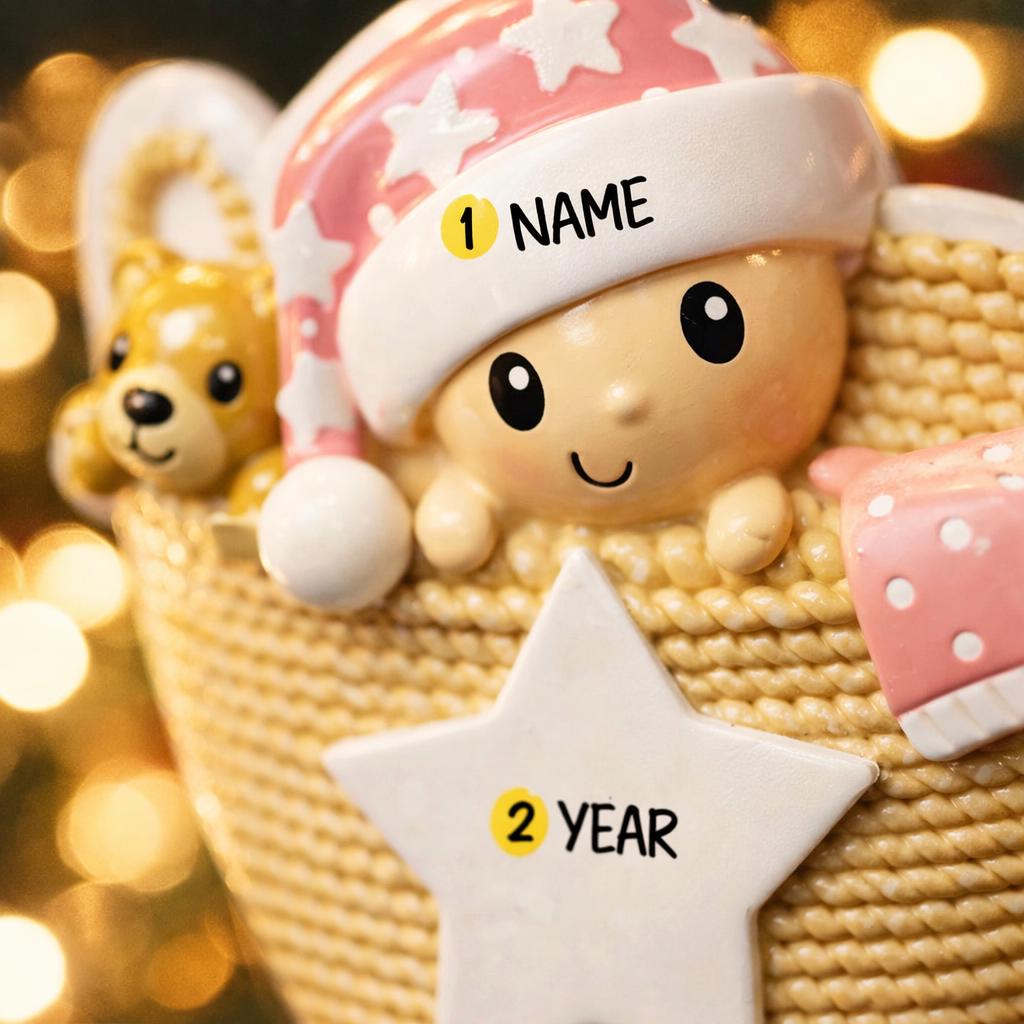 Personalized Baby Girl First Christmas Ornament featuring a detailed 3D front design with a sweet baby resting inside a woven basket, pink nightcap, teddy bear, and hanging star for the year. The baby’s name is added on the hat and the year on the star, creating a meaningful keepsake. Soft pink tones, cozy textures, and dimensional elements make it perfect for newborn girl gifts, baby shower presents, and treasured first Christmas tree memories.