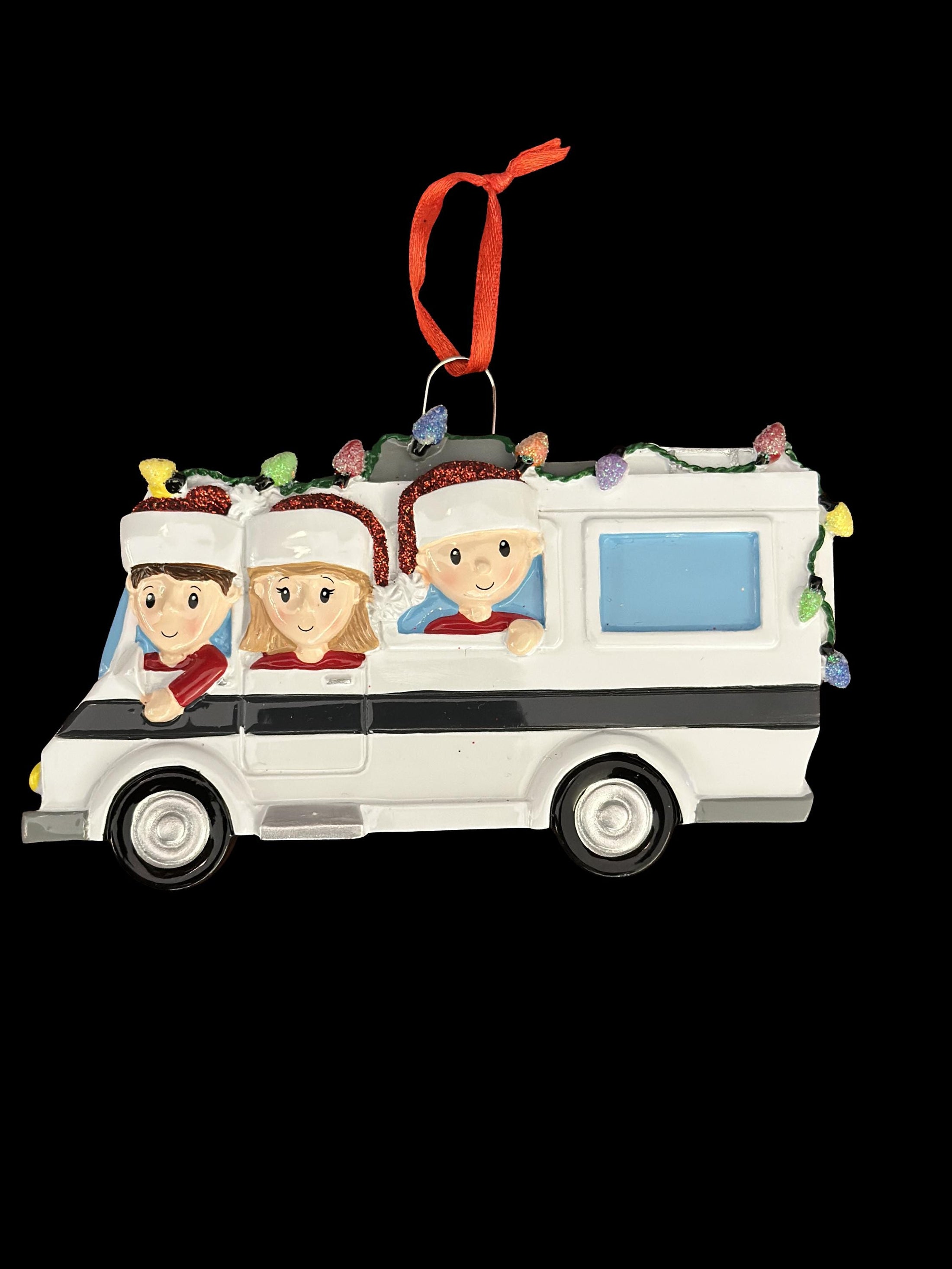 Decorative Christmas ornament of a family in a camper van with lights on a black background.
