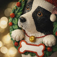Load image into Gallery viewer, Dog-shaped Christmas ornament with a wreath on a blurred lights background
