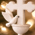 Load image into Gallery viewer, Decorative white dove and cross ornament with a blurred lights background
