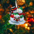 Load image into Gallery viewer, Personalized snowman family ornament with names on a blurred Christmas tree background
