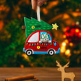 Load image into Gallery viewer, Festive cat themed Christmas ornament featuring a cheerful kitty riding in a red car with a decorated Christmas tree on top. Designed with playful holiday colors and a joyful winter atmosphere, this ornament adds a fun and cozy touch to any Christmas tree. Includes personalization options for name and year, making it a unique keepsake for cat lovers and pet themed holiday decor.

