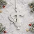 Load image into Gallery viewer, Decorative Christmas ornament with a dove and cross on a snowy background
