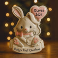 Load image into Gallery viewer, Decorative ceramic rabbit figurine with a heart-shaped balloon and 'Oliver 2023' text, set against a warm, blurred background.
