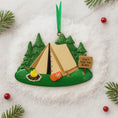 Load image into Gallery viewer, Camping-themed Christmas ornament with a tent, fire, and sign on a snowy background.
