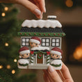 Load image into Gallery viewer, Decorative Christmas ornament of a house with three children on a blurred Christmas tree background.
