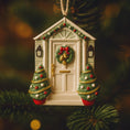 Load image into Gallery viewer, Decorative Christmas ornament shaped like a house with trees and a wreath on a tree.
