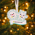 Load image into Gallery viewer, Personalized snowflake couple ornament featuring two smiling snowflakes, customized with two names and a year or family name. A perfect Christmas keepsake for couples, partners, siblings, or loved ones celebrating winter memories together. This festive ornament adds a playful and heartfelt touch to holiday decor, making it a meaningful gift for Christmas, anniversaries, or winter celebrations.


