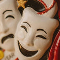 Load image into Gallery viewer, Close-up of a ceramic mask with a smiling expression and decorative elements.
