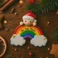 Load image into Gallery viewer, Decorative Christmas ornament with a rainbow and text on a wooden surface with festive elements.
