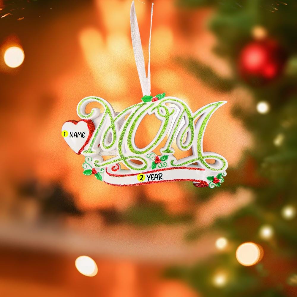 Decorative Christmas ornament with '2021' on a blurred Christmas tree background