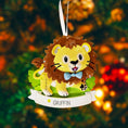 Load image into Gallery viewer, Lion themed Christmas ornament designed with a playful and colorful style, perfect for kids and animal lovers. This ornament features a lion character standing on a grassy base with a glossy finish and cheerful details. The design includes a personalization option, allowing a custom name and year to be added, making it a meaningful keepsake for children or family holiday traditions. Ideal for Christmas trees, nursery decor, or as a unique personalized gift for animal themed celebrations.
