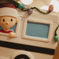 Load image into Gallery viewer, Decorative figurine of a child in a car with Christmas lights.
