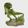 Load image into Gallery viewer, Realistic dinosaur themed Christmas ornament featuring a detailed T-Rex design with vibrant green tones and a playful yet bold appearance. Styled in a warm holiday setting, this ornament is designed to be personalized and makes a fun keepsake for kids who love dinosaurs and adventure themed decorations
