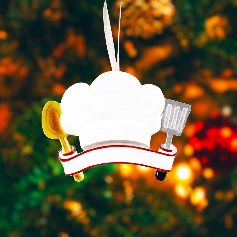 Personalized chef Christmas ornament featuring a white chef hat design with a wooden spoon and metal spatula details. Customized with a name and year on the front banner. Glossy resin finish with clean white and red accents creates a fun and professional cooking themed holiday look. Mostly 2D ornament with raised 3D details on the front only, lightweight and perfect for Christmas tree decor or kitchen themed gifts.