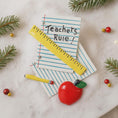 Load image into Gallery viewer, Decorative items including a yellow ruler, red apple, and pen on lined paper with 'Teachers Rule!' text, surrounded by Christmas decorations.
