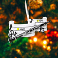 Load image into Gallery viewer, Decorative clarinet ornament with customizable text on a blurred Christmas tree background

