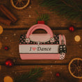 Load image into Gallery viewer, Decorative accessory shaped like a pink handbag with 'I ❤️ Dance' text on a wooden surface with Christmas decorations.
