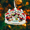 Load image into Gallery viewer, Personalized Christmas ornament with penguins in winter attire on a blurred festive background
