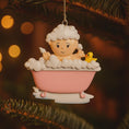 Load image into Gallery viewer, Decorative ornament of a baby in a bath with bubbles and a rubber duck, hanging on a tree.
