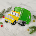 Load image into Gallery viewer, Cute personalized garbage truck ornament in green and yellow with animated truck face. Custom name and year option for kids who love trucks, garbage trucks, city vehicles and recycling themes. Perfect holiday tree decor for boys and toddlers obsessed with trucks. Bright colors, fun design, and adorable Christmas keepsake.
