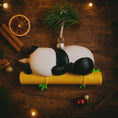 Load image into Gallery viewer, Fully 3D personalized unicorn panda Christmas ornament featuring a sleeping panda resting on a bamboo branch with a pastel unicorn horn. This ornament has a fully sculpted three dimensional front and back with no flat surfaces, creating a playful and premium look. Custom name and year are added by hand. Perfect for kids, panda lovers, unicorn fans, and whimsical holiday decor. A unique 3D keepsake for Christmas trees and seasonal displays.

