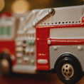 Load image into Gallery viewer, Close-up of a toy fire truck with a blurred background
