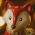 Load image into Gallery viewer, Close-up of a fox-shaped candle with a warm glow

