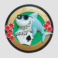 Load image into Gallery viewer, Personalized poker ornament featuring a cool shark character wearing sunglasses with playing cards and red casino chips. Designed in a round ornament style with a glossy finish. Includes free handwritten personalization with one name and year displayed on the front. Shown hanging with a ribbon in a festive holiday setting with greenery snow and seasonal decor. 3D raised front and flat back design perfect for Christmas trees and gifts for poker players casino lovers and card game fans.
