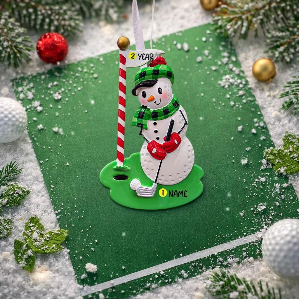 Snowman golf ornament on a green background with festive decorations