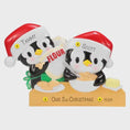 Load image into Gallery viewer, Cute penguin couple ornament featuring two festive penguins baking together, dressed in Santa hats and sharing a cozy holiday moment. This playful Christmas ornament is perfect for couples, partners, siblings, or loved ones who enjoy cooking, baking, or spending time together during the holidays. A charming keepsake that adds warmth, fun, and personality to any Christmas tree or seasonal decor.

