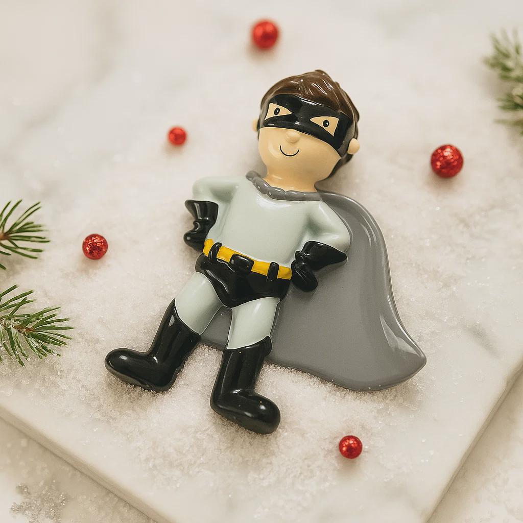 Personalized superhero boy Christmas ornament featuring a mask, cape and custom name. Cute holiday decor for boys, perfect for Christmas trees and gift-giving. Add name and year to create a unique keepsake. Display photos are AI-generated; please check the first image for the original product.