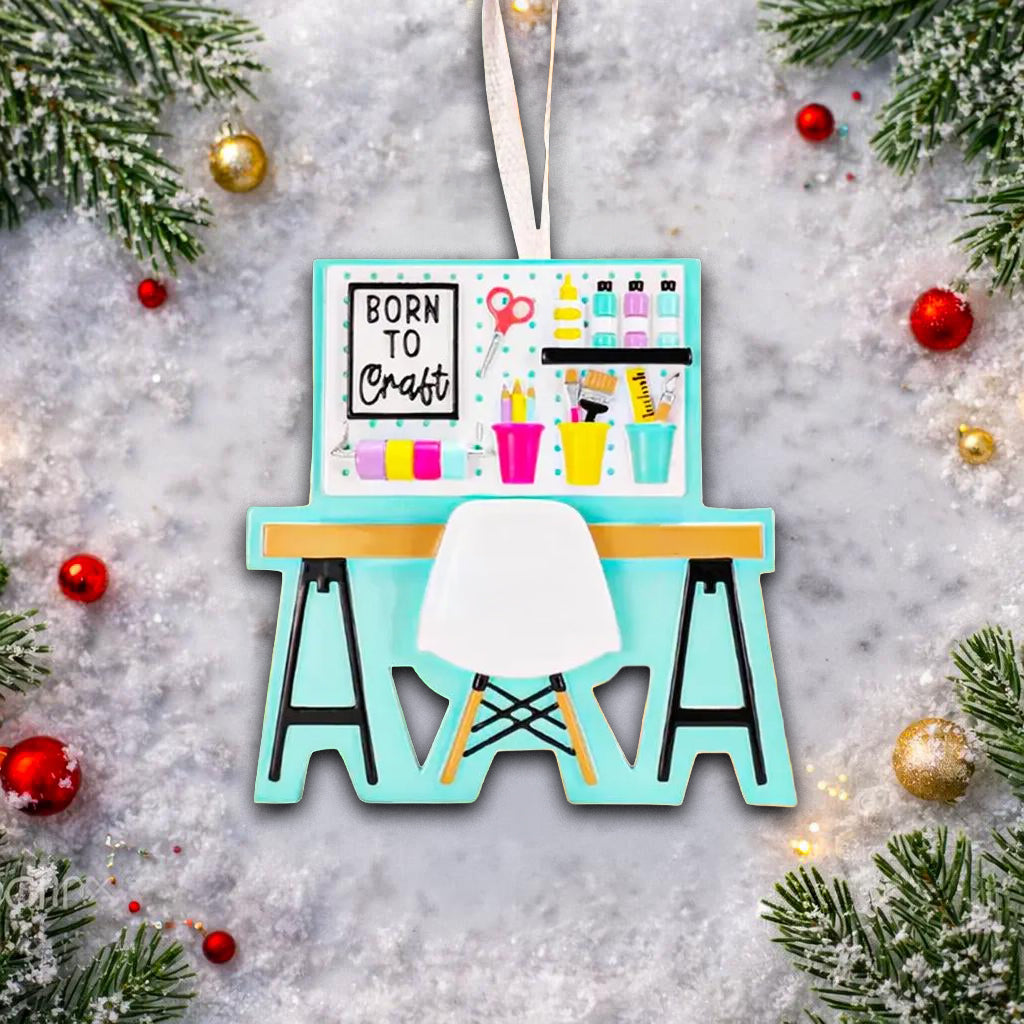 Born to Craft ornament featuring a creative desk scene with colorful craft supplies including scissors paint bottles brushes pencils and storage cups. The ornament showcases a playful crafting workspace design with a modern chair and desk setup. Made from durable resin with a detailed 3D front and flat 2D back for smooth hanging. Includes free handwritten personalization making it a perfect gift for crafters artists DIY lovers and creative kids. Ideal for Christmas trees craft rooms studios and handmade the