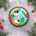 Load image into Gallery viewer, Personalized poker ornament featuring a cool shark character wearing sunglasses with playing cards and red casino chips. Designed in a round ornament style with a glossy finish. Includes free handwritten personalization with one name and year displayed on the front. Shown hanging with a ribbon in a festive holiday setting with greenery snow and seasonal decor. 3D raised front and flat back design perfect for Christmas trees and gifts for poker players casino lovers and card game fans.
