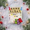 Load image into Gallery viewer, Personalized game night ornament featuring a playful board game inspired design with dice tiles and colorful game pieces. Includes free handwritten personalization with name or names and year displayed on the front. Designed with a raised 3D front and flat back for easy hanging. Perfect for board game lovers family game nights and Christmas tree decor. A fun keepsake gift for friends couples and families who love game nights.
