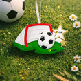 Load image into Gallery viewer, Personalized soccer ornament featuring a detailed goal and ball design with a glossy finish and raised 3D details. The ornament includes one custom name and year displayed on the front. Styled with festive lighting and greenery, this sports themed ornament is perfect for soccer lovers, players, and coaches. Designed with a 3D front and flat back, lightweight and easy to hang on a Christmas tree or display year round.

