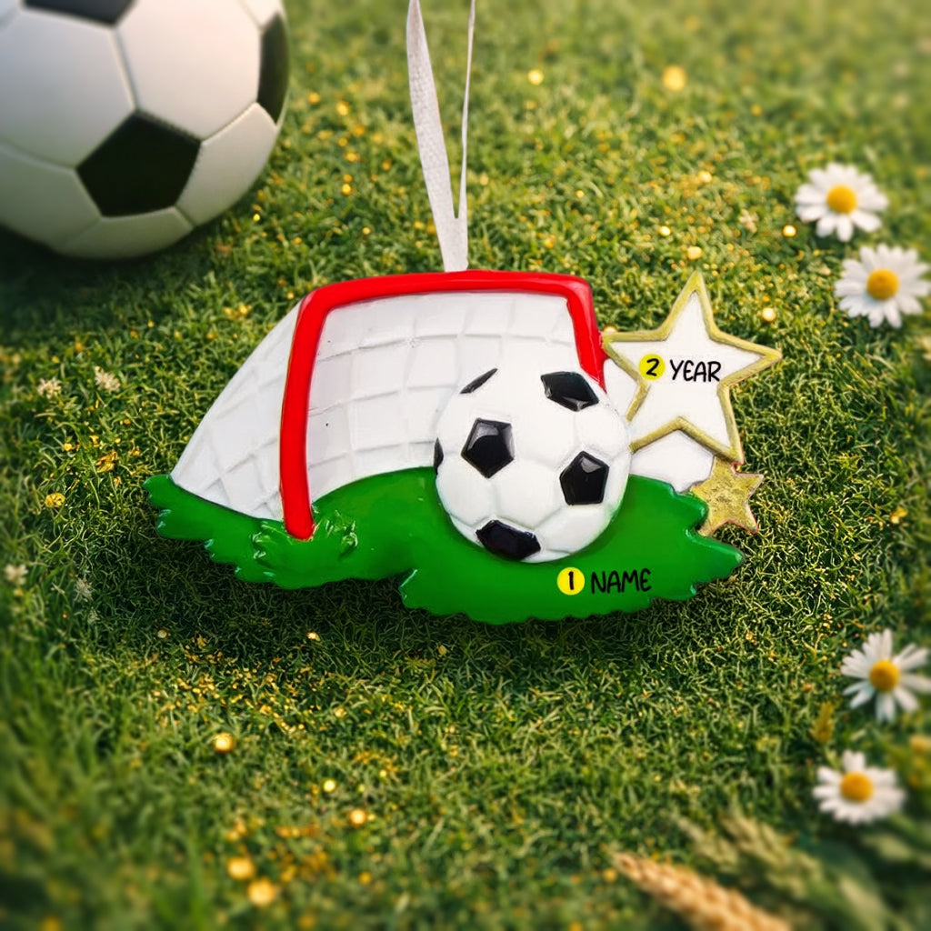 Personalized soccer ornament featuring a detailed goal and ball design with a glossy finish and raised 3D details. The ornament includes one custom name and year displayed on the front. Styled with festive lighting and greenery, this sports themed ornament is perfect for soccer lovers, players, and coaches. Designed with a 3D front and flat back, lightweight and easy to hang on a Christmas tree or display year round.
