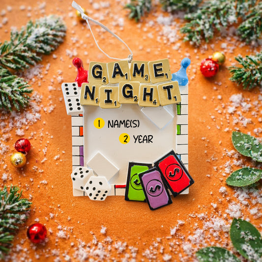 Personalized game night ornament featuring a playful board game inspired design with dice tiles and colorful game pieces. Includes free handwritten personalization with name or names and year displayed on the front. Designed with a raised 3D front and flat back for easy hanging. Perfect for board game lovers family game nights and Christmas tree decor. A fun keepsake gift for friends couples and families who love game nights.